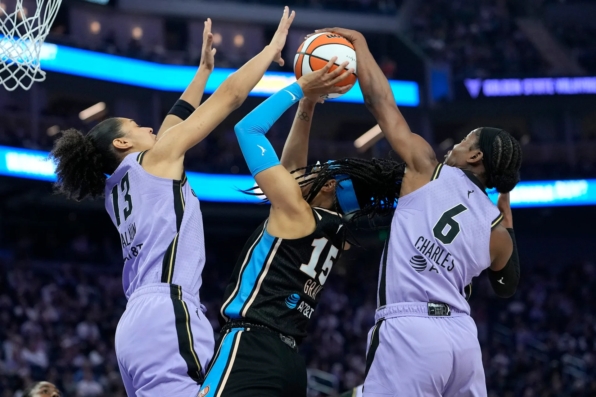 Atlanta Dream player drives past a Golden State Valkyries defender